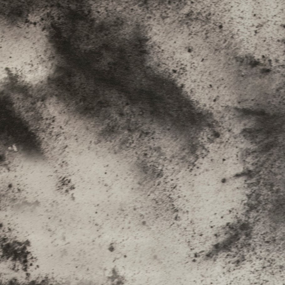 Glaslaminat-Oberflaeche mit wolkiger Anthrazit-Steinoptik und diffuser schwarz-grauer Texturierung